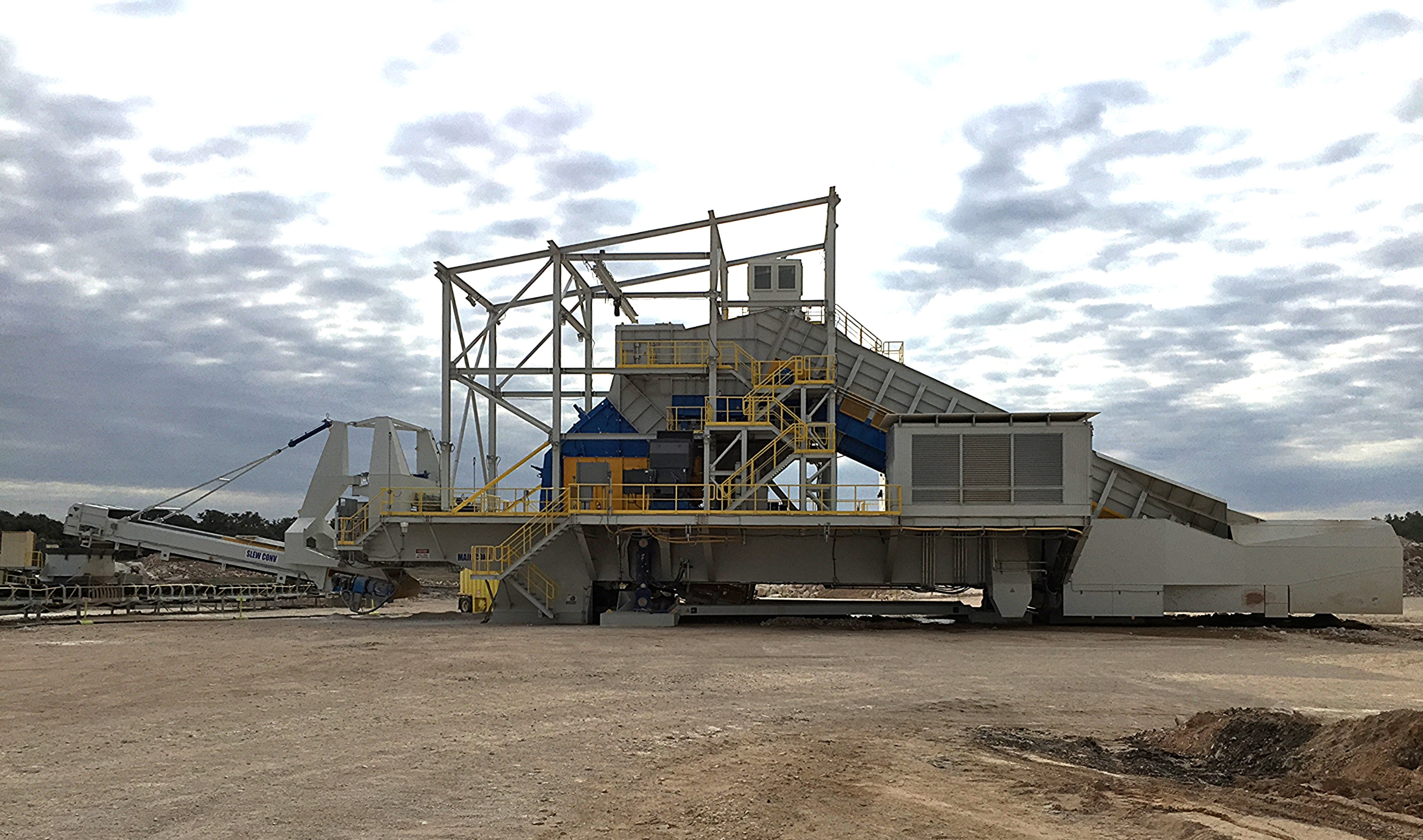 A mineral processing machine sitting on the ground in a mining facility