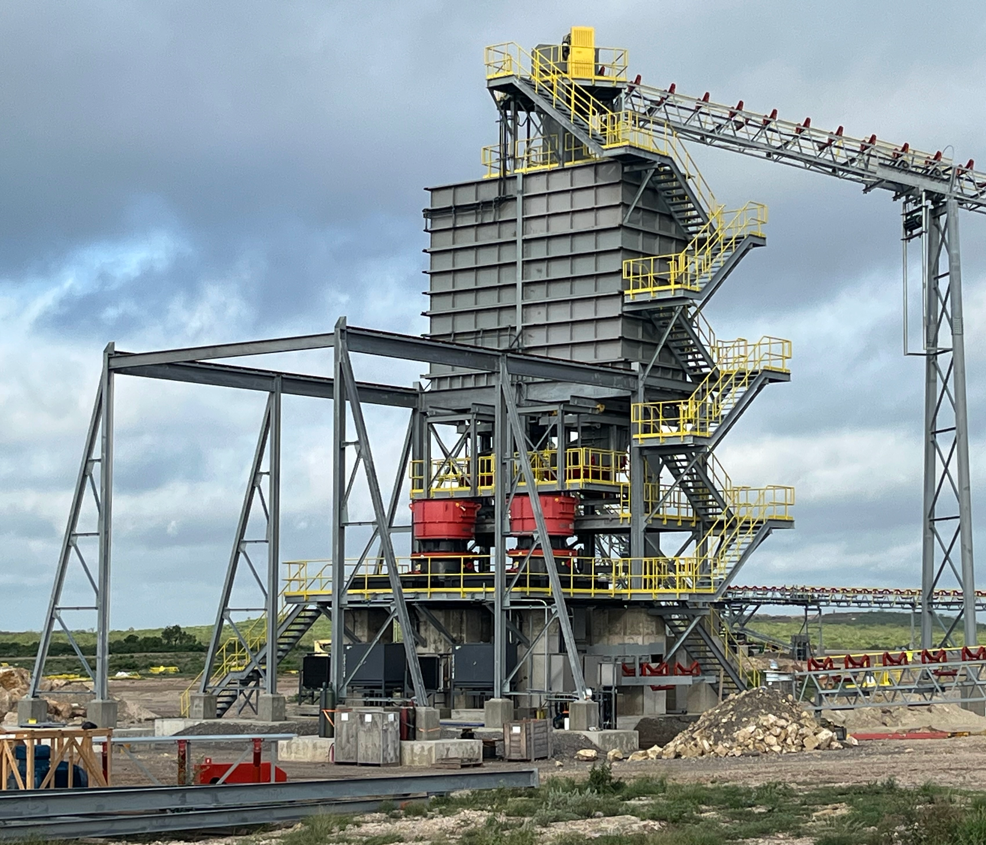 A mineral processing machine sitting on the ground in a mining facility